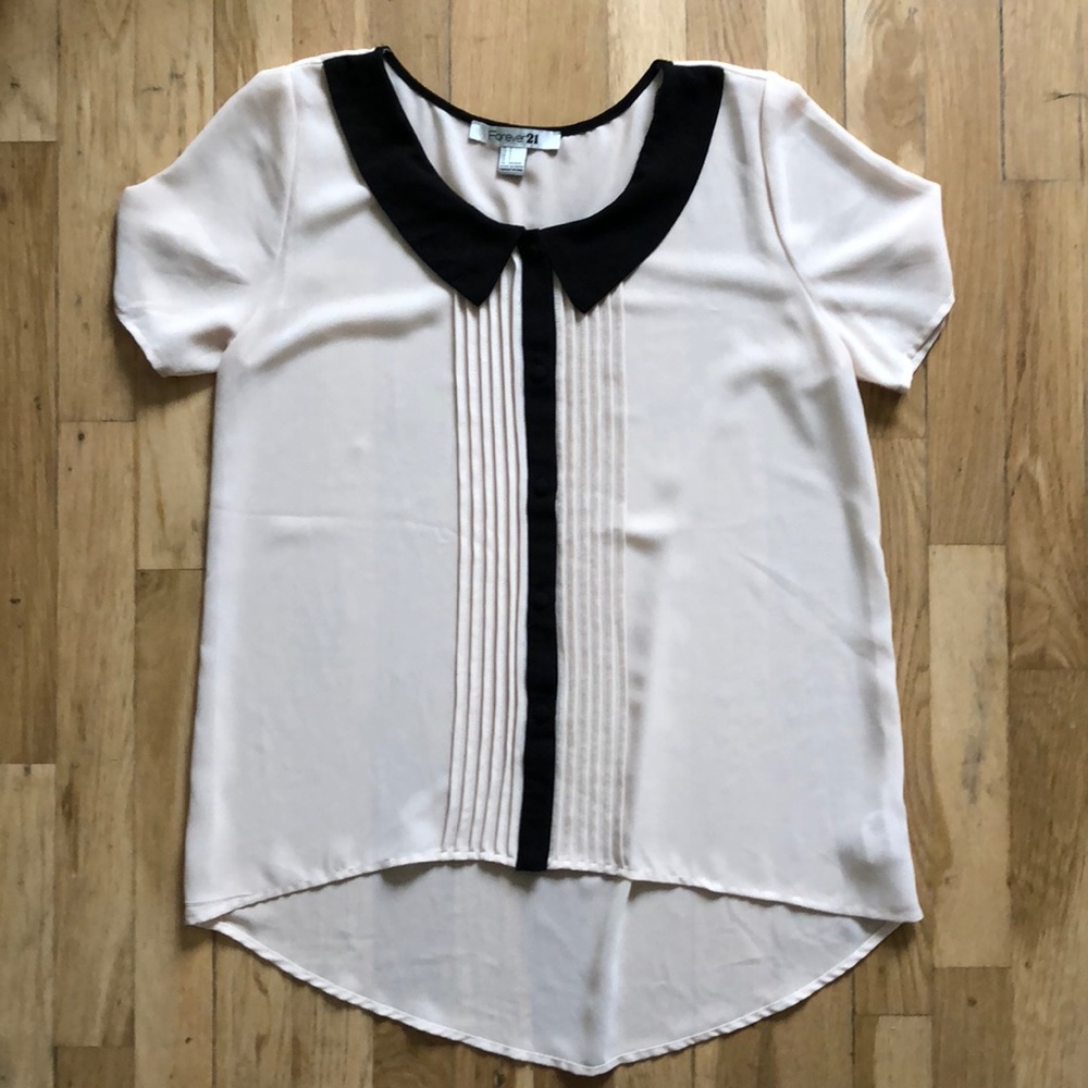 Blush and black blouse